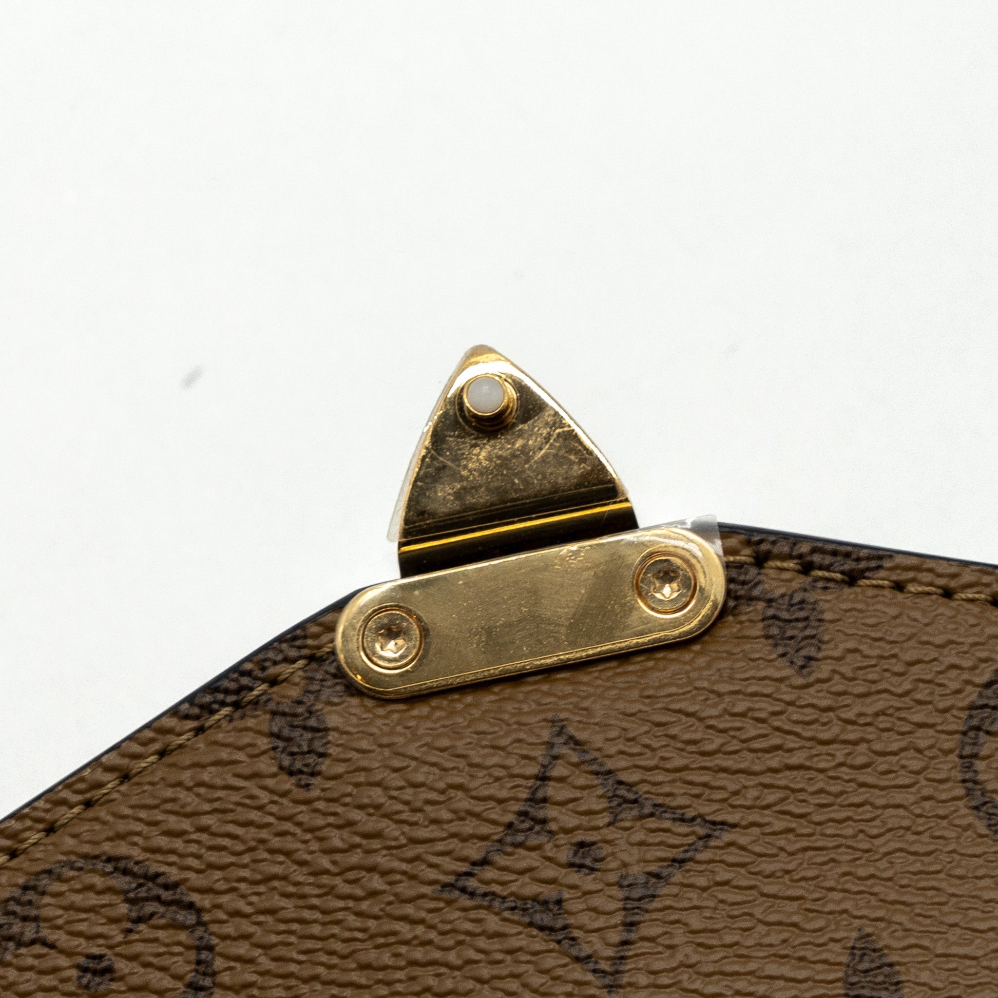 LOUIS VUITTON POCHETTE MÉTIS MONOGRAM REVERSE CANVAS GHW