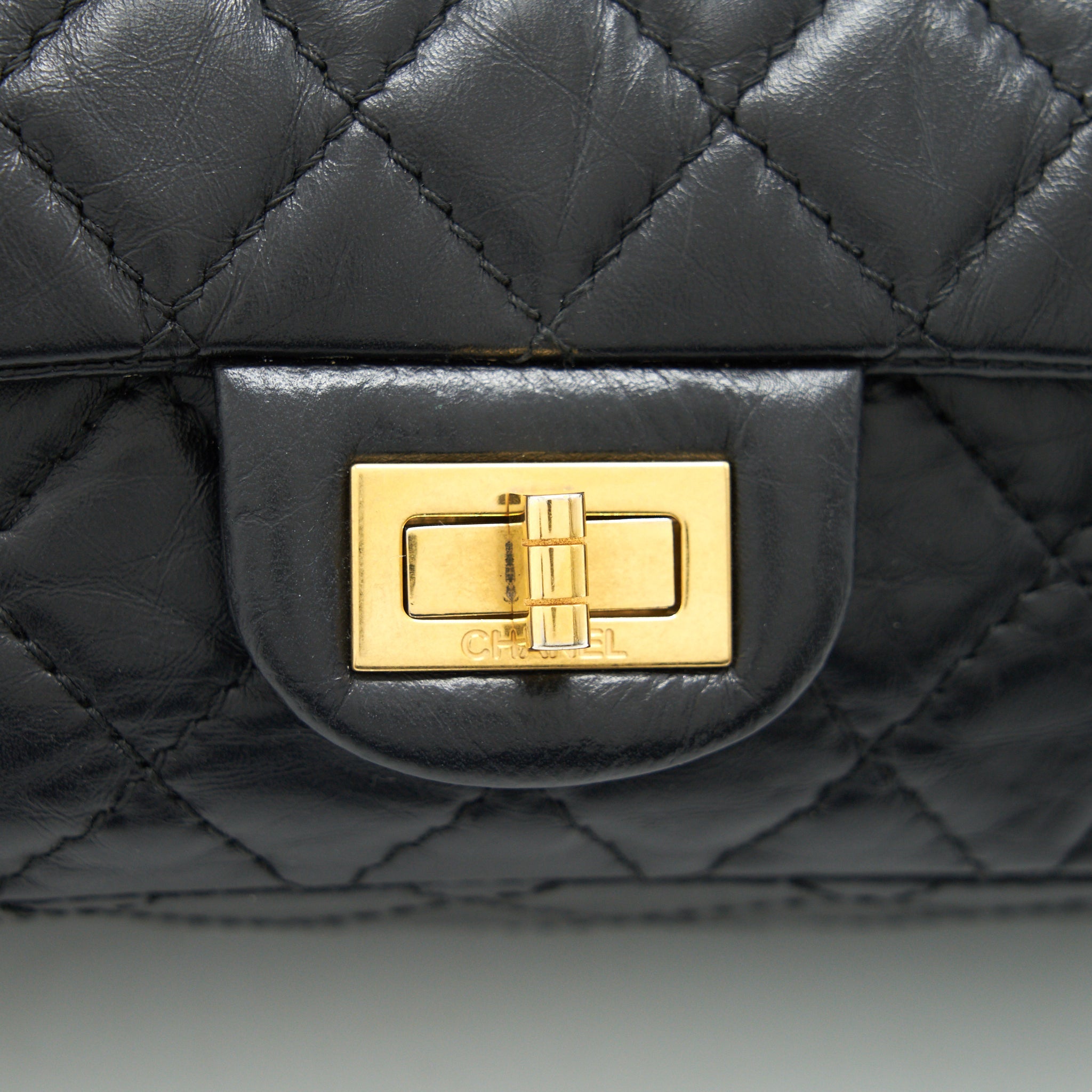 CHANEL 2.55 REISSUE SMALL FLAP BAG AGED CALFSKIN IN BLACK GHW