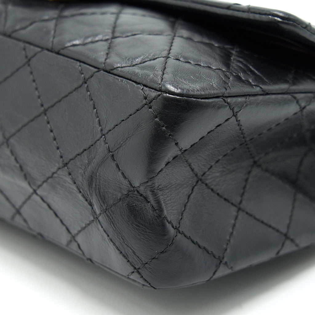 CHANEL 2.55 REISSUE SMALL FLAP BAG AGED CALFSKIN IN BLACK GHW