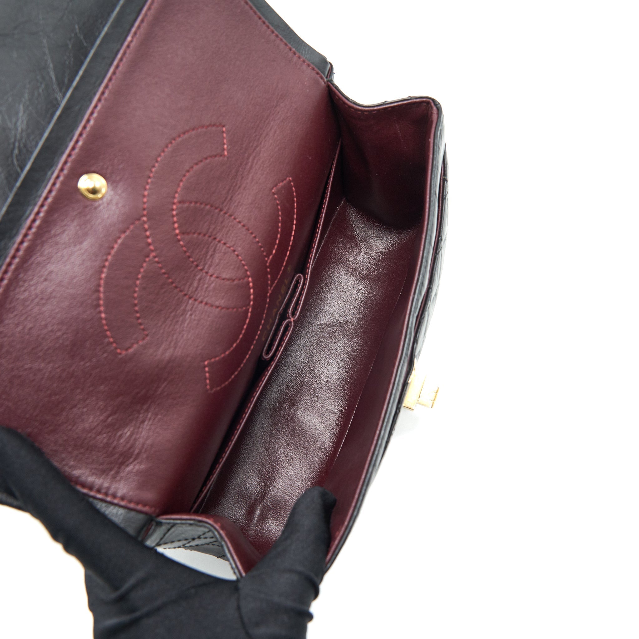 CHANEL 2.55 REISSUE SMALL FLAP BAG AGED CALFSKIN IN BLACK GHW