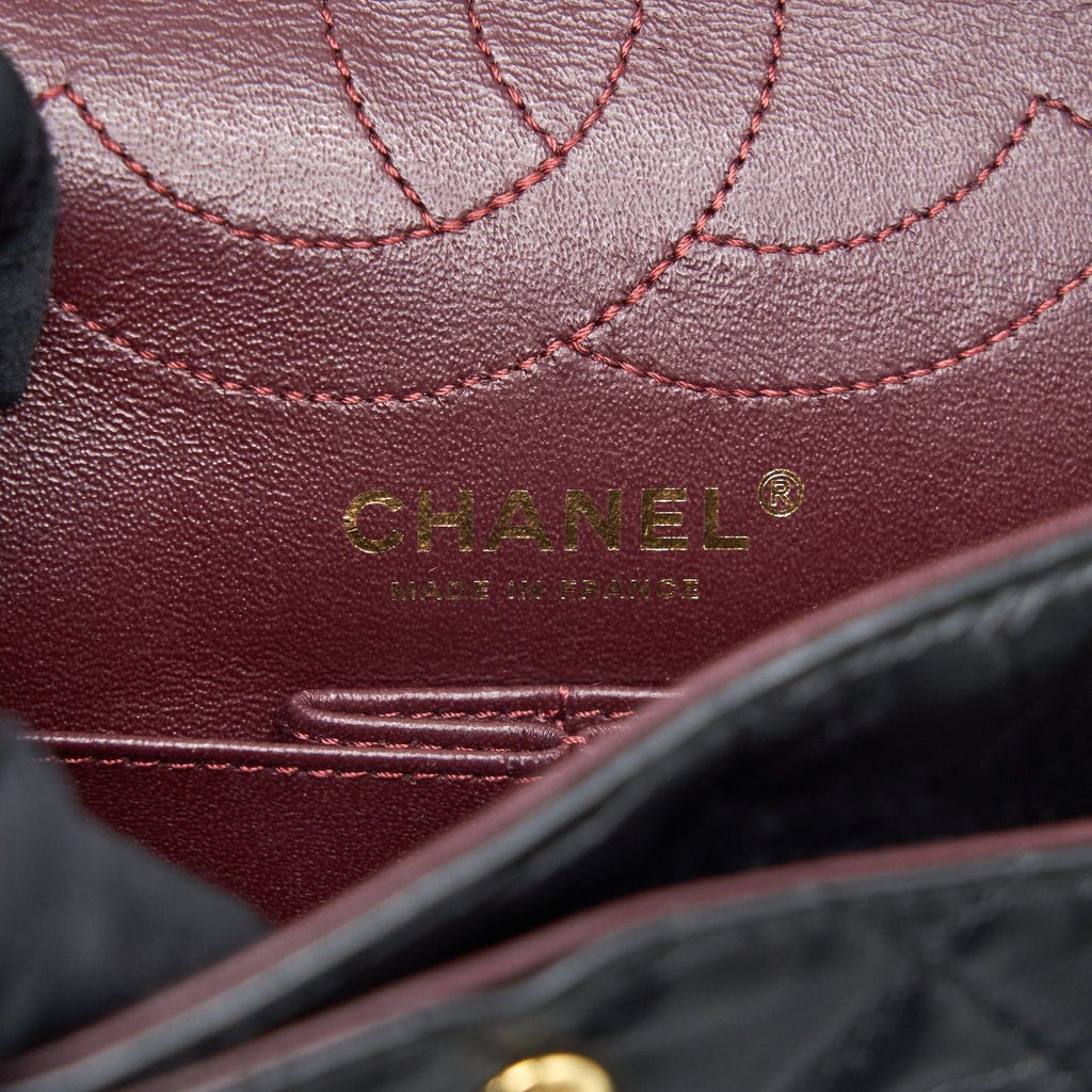 CHANEL 2.55 REISSUE SMALL FLAP BAG AGED CALFSKIN IN BLACK GHW