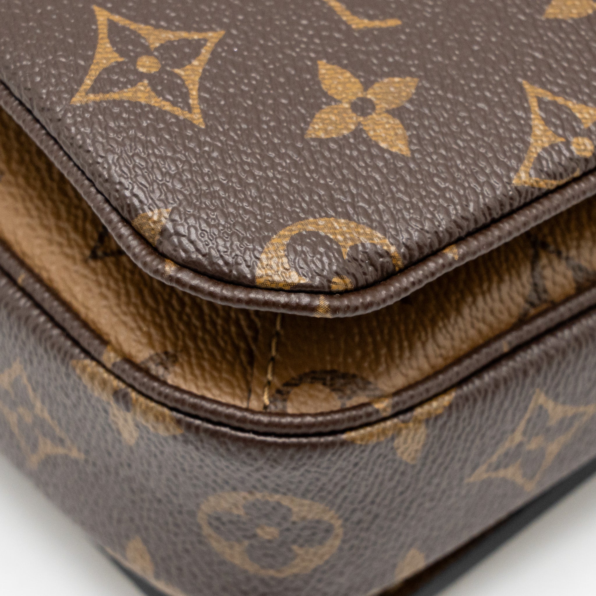 LOUIS VUITTON POCHETTE MÉTIS MONOGRAM REVERSE CANVAS GHW