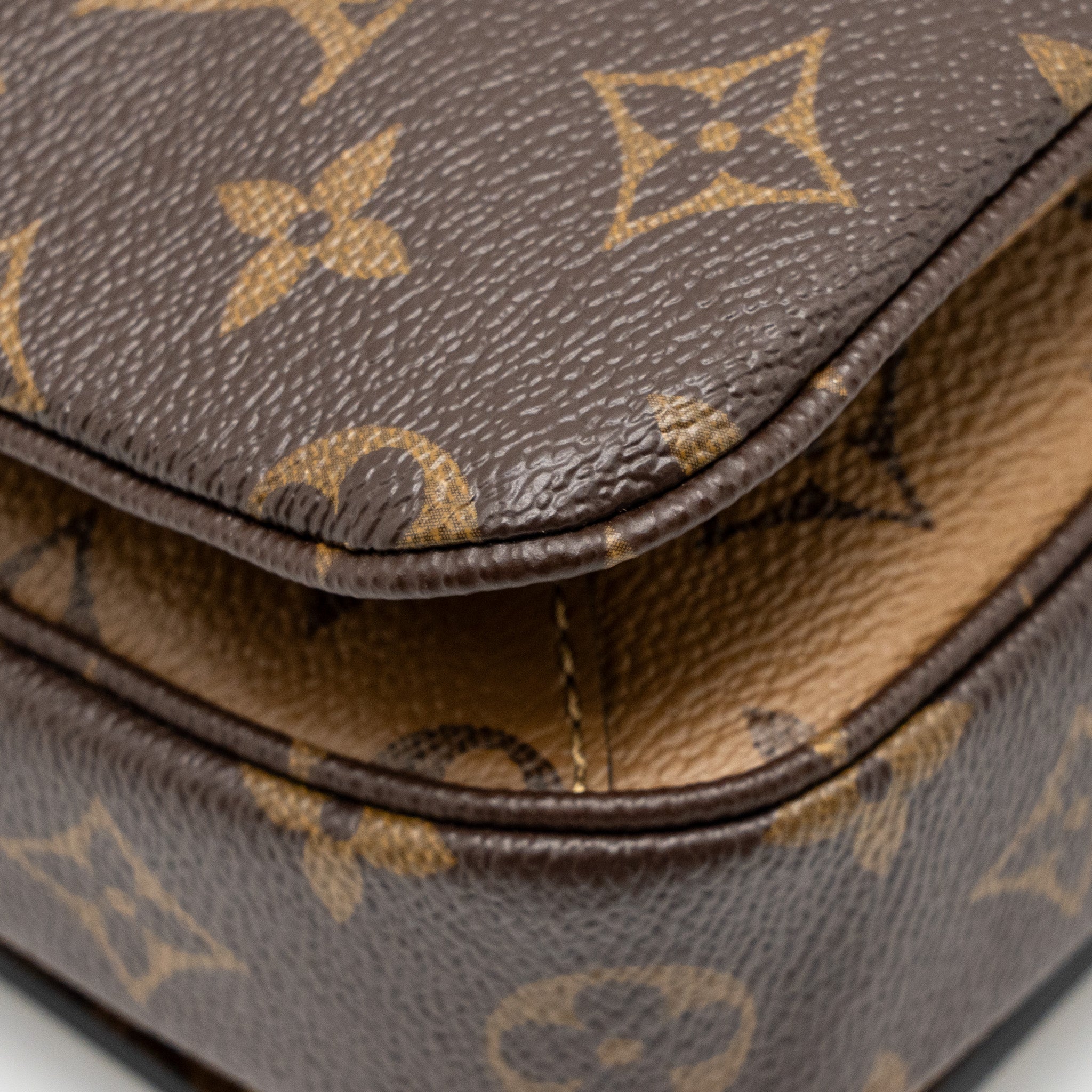 LOUIS VUITTON POCHETTE MÉTIS MONOGRAM REVERSE CANVAS GHW