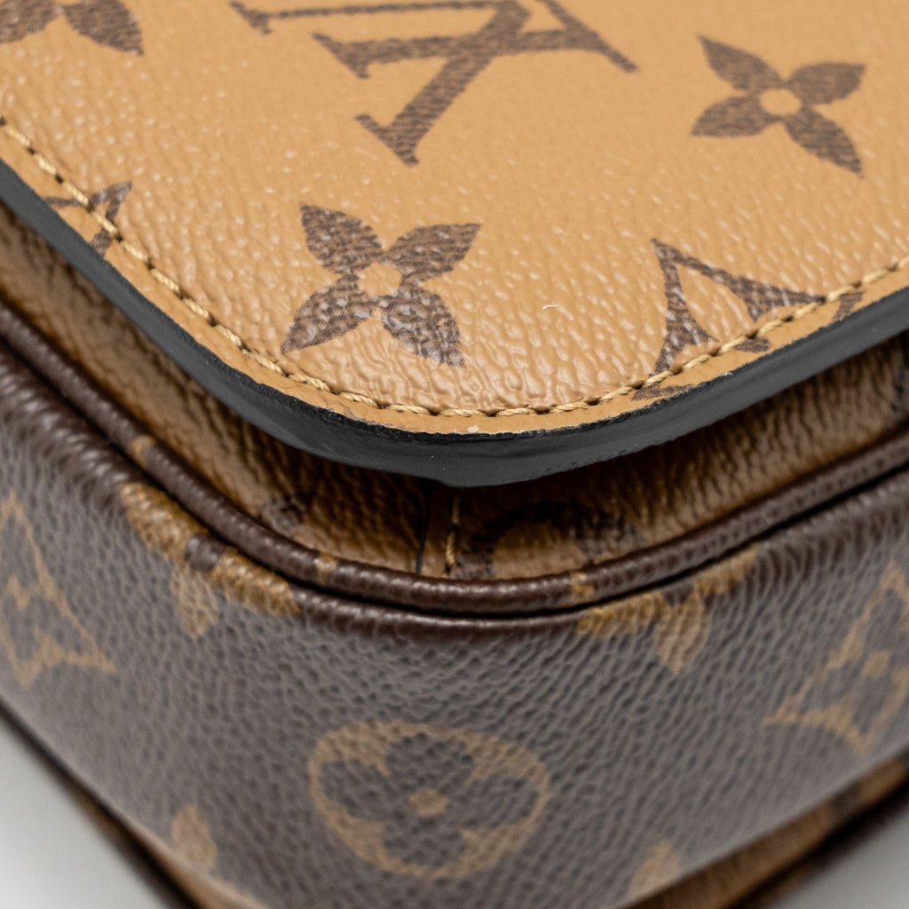 LOUIS VUITTON POCHETTE MÉTIS MONOGRAM REVERSE CANVAS GHW