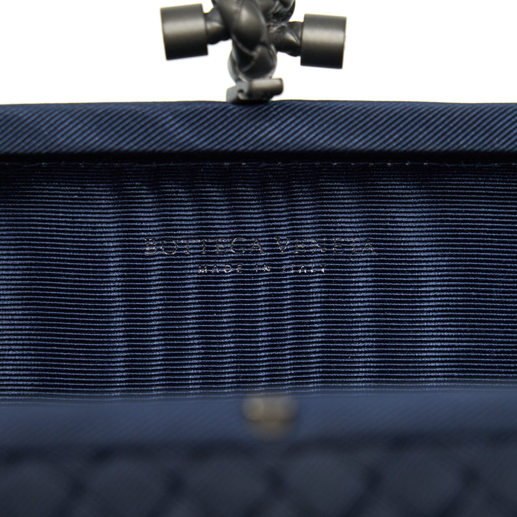 BOTTEGA VENETA KNOT CLUTCH IN NAVY WITH RUTHENIUM HARDWARE