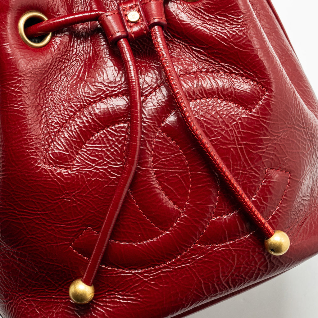CHANEL CC DRAWSTRING MINI BUCKET BAG SHINY AGED CALFSKIN RED GHW