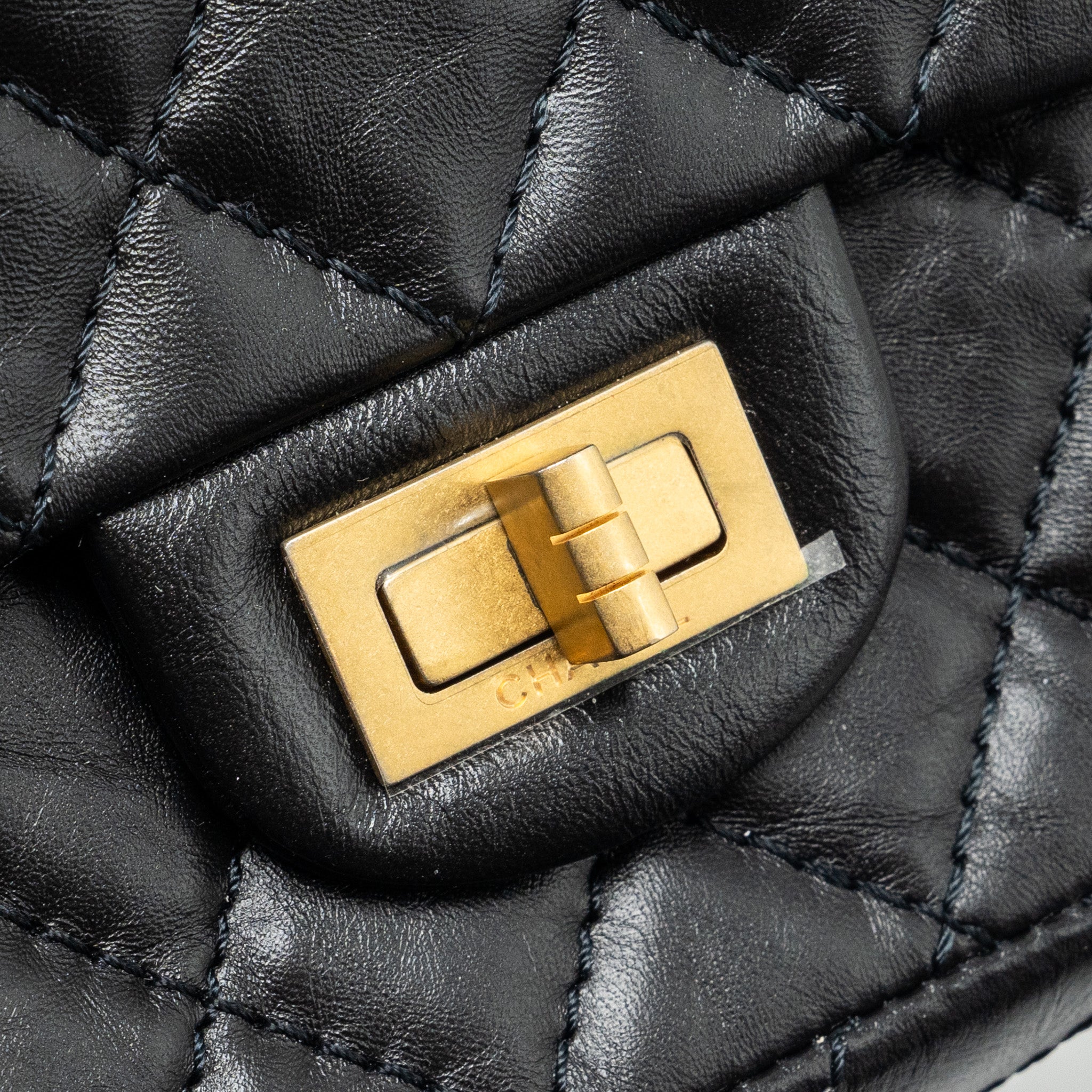 CHANEL MINI 2.55 REISSUE FLAP BAG AGED CALFSKIN BLACK GHW