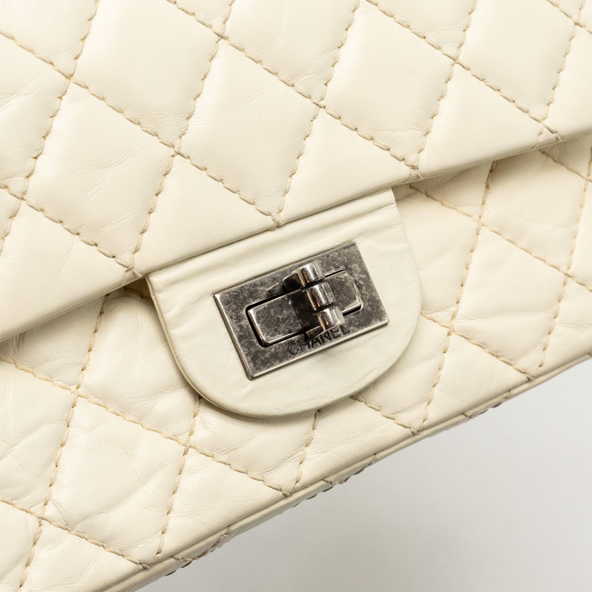 CHANEL MINI 2.55 REISSUE FLAP BAG AGED CALFSKIN CREAMY WHITE WITH RUTHENIUM HARDWARE