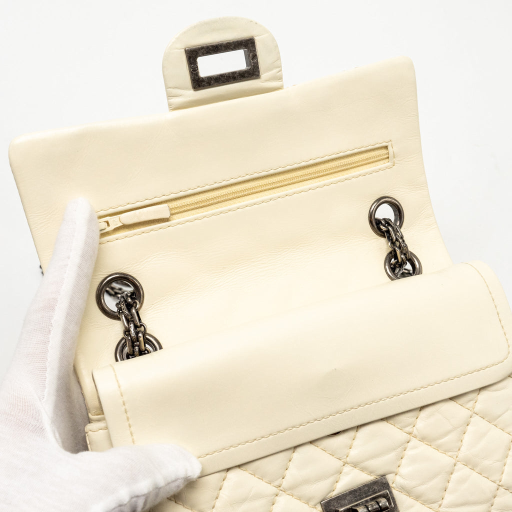 CHANEL MINI 2.55 REISSUE FLAP BAG AGED CALFSKIN CREAMY WHITE WITH RUTHENIUM HARDWARE