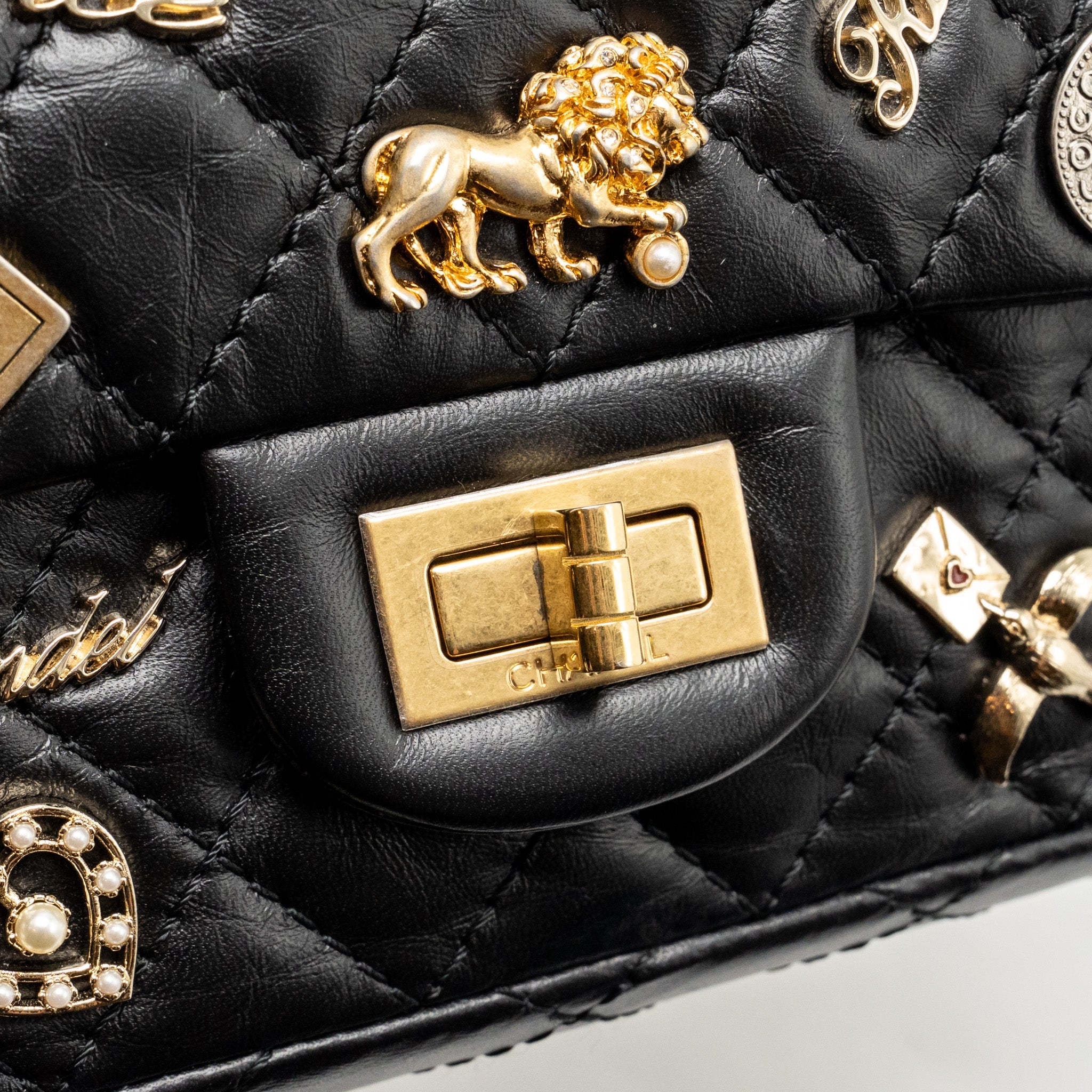 CHANEL MINI 2.55 REISSUE FLAP BAG LUCKY CHARMS AGED CALFSKIN BLACK GHW