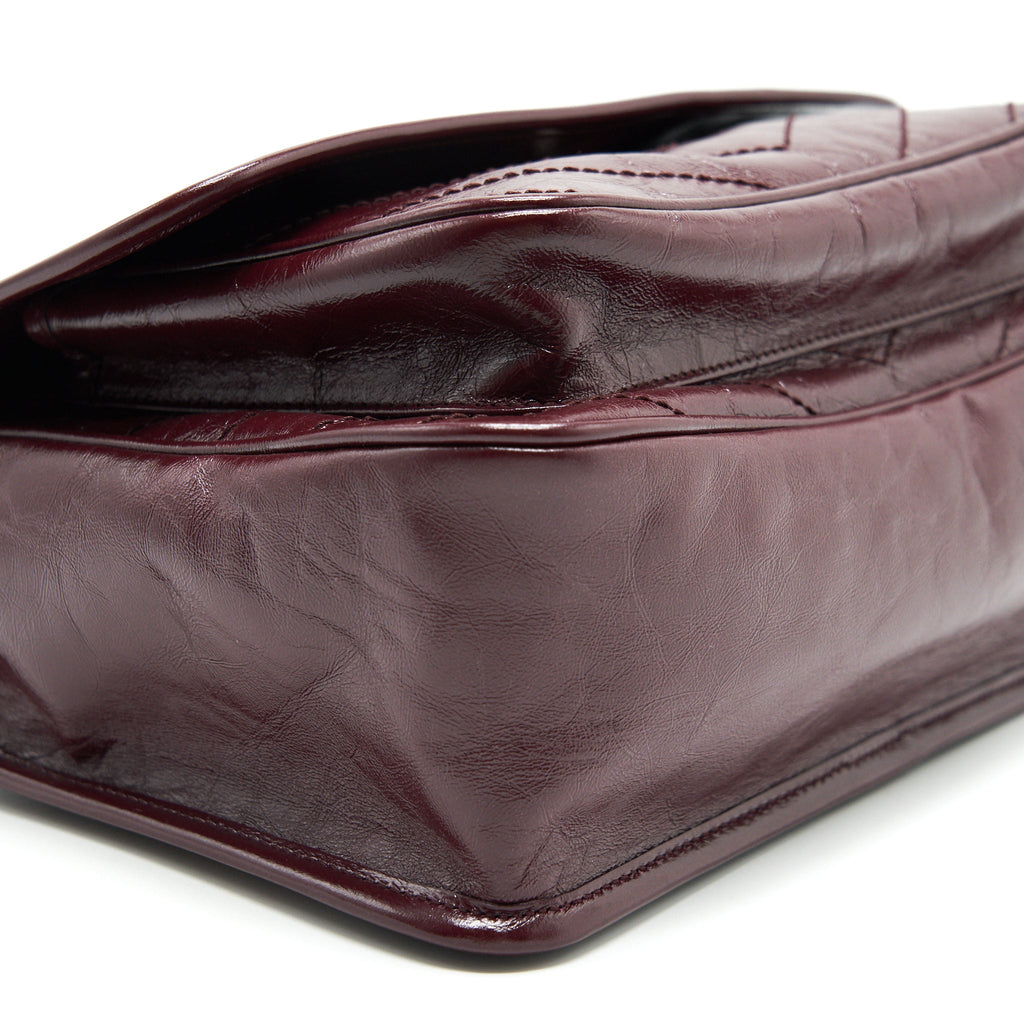 SAINT LAURENT MEDIUM NIKI SHINNY LEATHER BURGUNDY