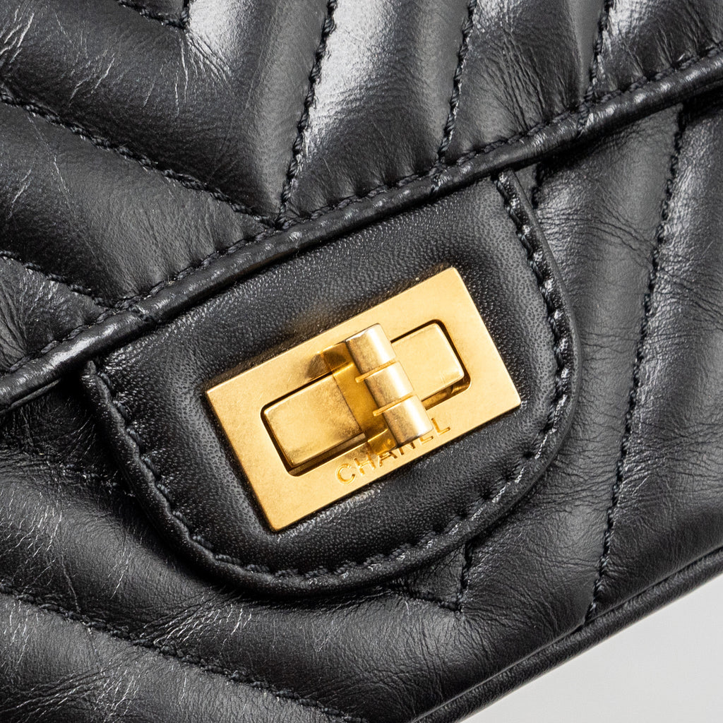 CHANEL MINI 2.55 REISSUE FLAP BAG CHEVRON AGED CALFSKIN BLACK GHW (MICROCHIP)