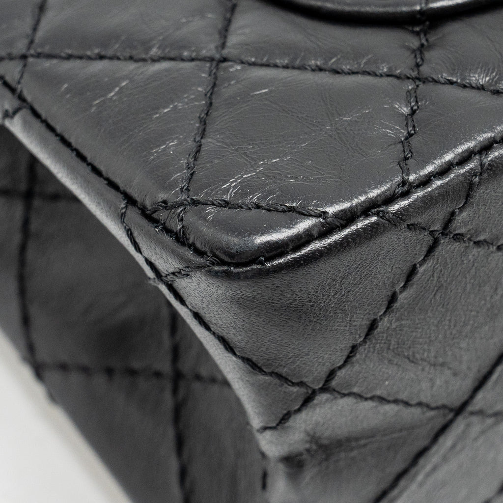 CHANEL MINI 2.55 REISSUE FLAP BAG AGED CALFSKIN BLACK GHW