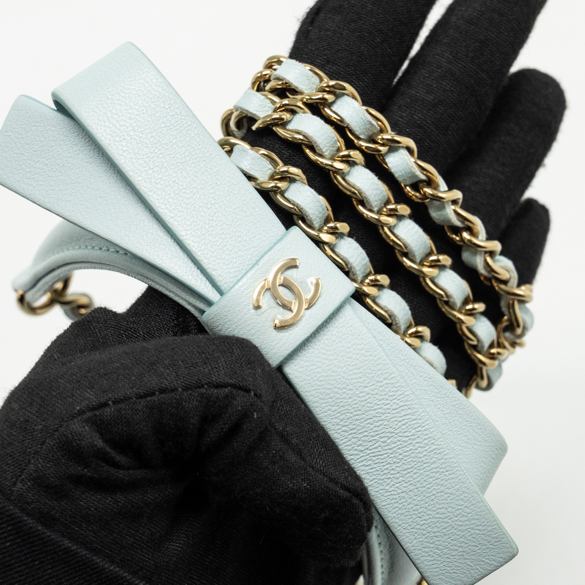 CHANEL MINI ROUND VANITY WITH RIBBON ON CHAIN LAMBSKIN LIGHT BLUE LGHW