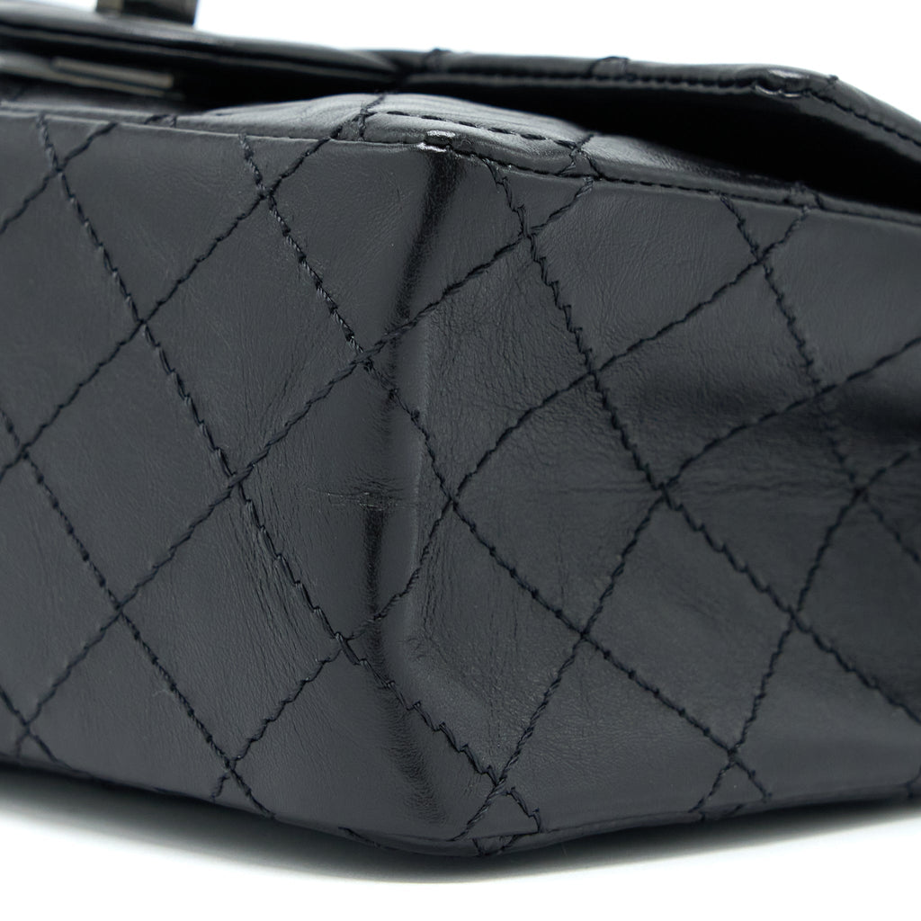 CHANEL MINI 2.55 REISSUE AGED CALFSKIN SO BLACK WITH BLACK HARDWARE (MICROCHIP)