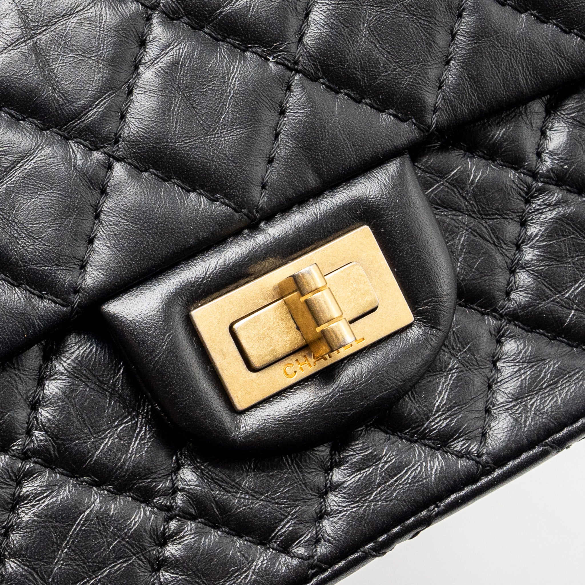 CHANEL MINI 2.55 REISSUE FLAP BAG AGED CALFSKIN BLACK GHW