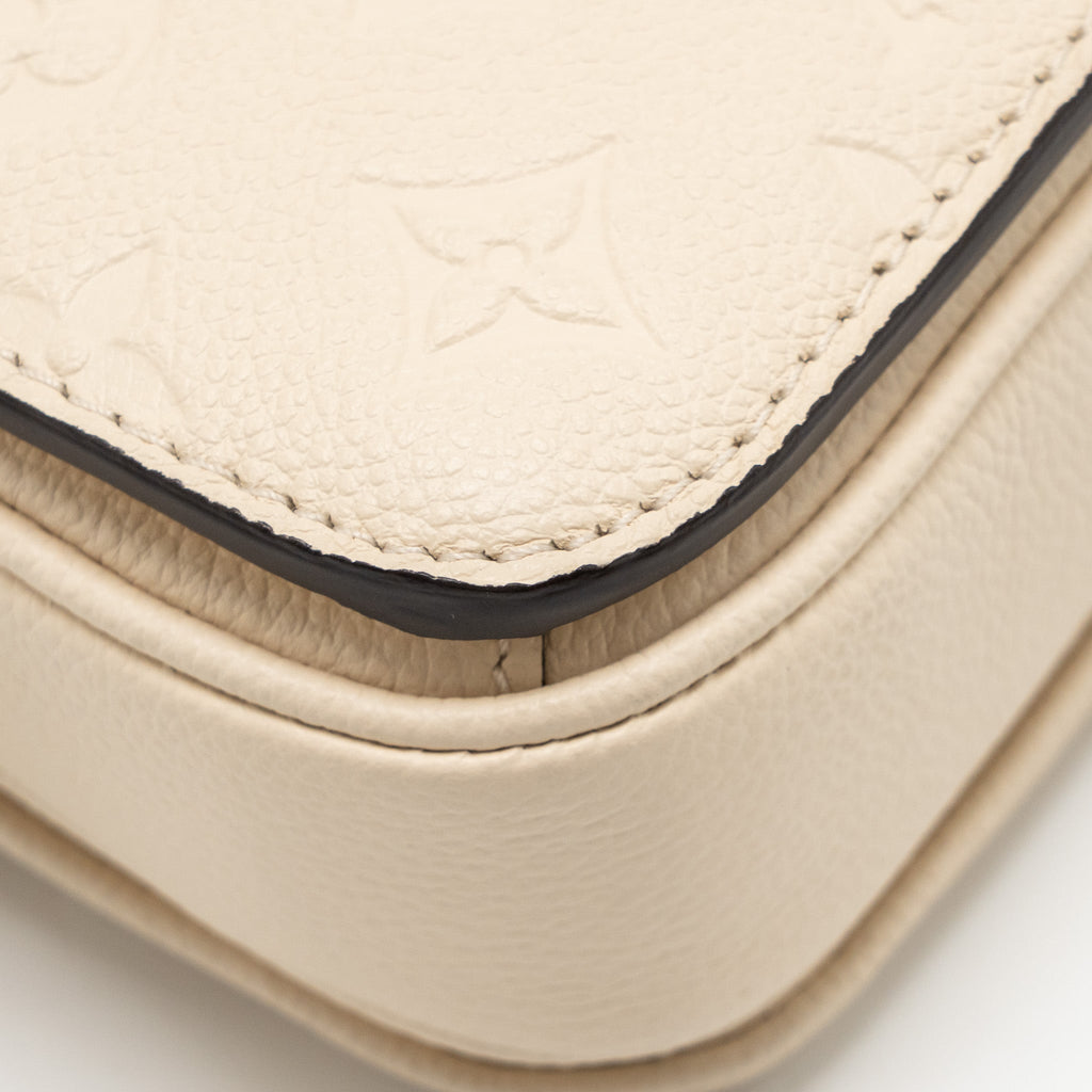 LOUIS VUITTON POCHETTE MÉTIS EAST WEST MONOGRAM EMPREINTE LEATHER CREAM GHW