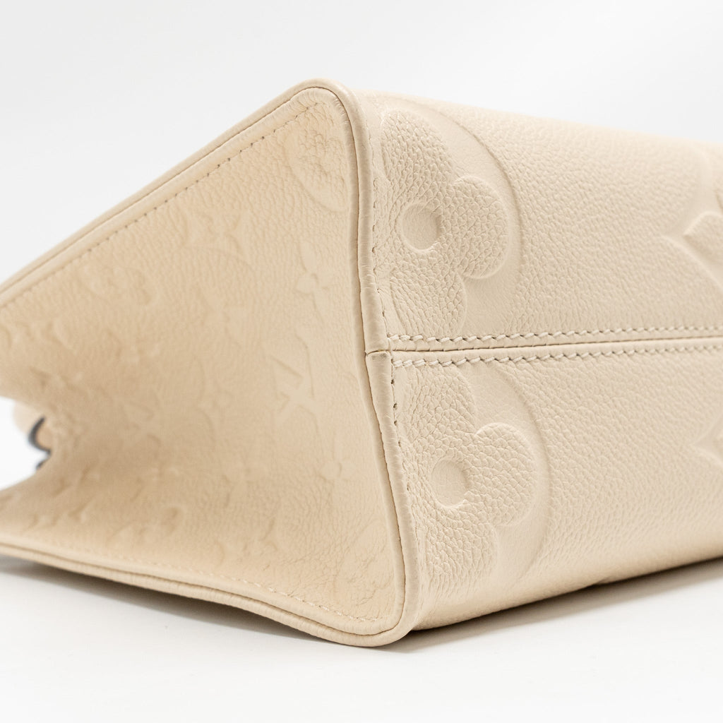 LOUIS VUITTON ONTHEGO PM MONOGRAM EMPREINTE LEATHER CREME GHW