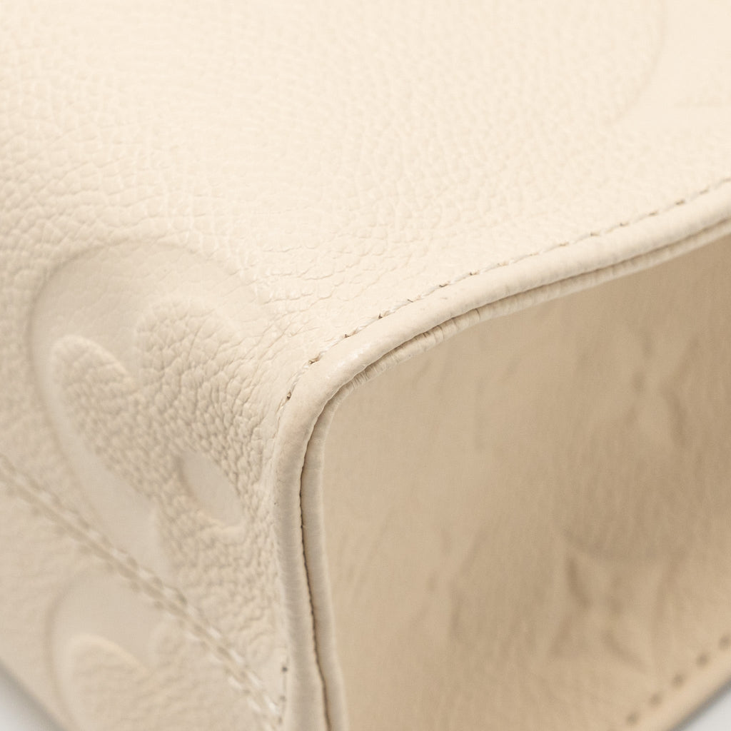 LOUIS VUITTON ONTHEGO PM MONOGRAM EMPREINTE LEATHER CREME GHW