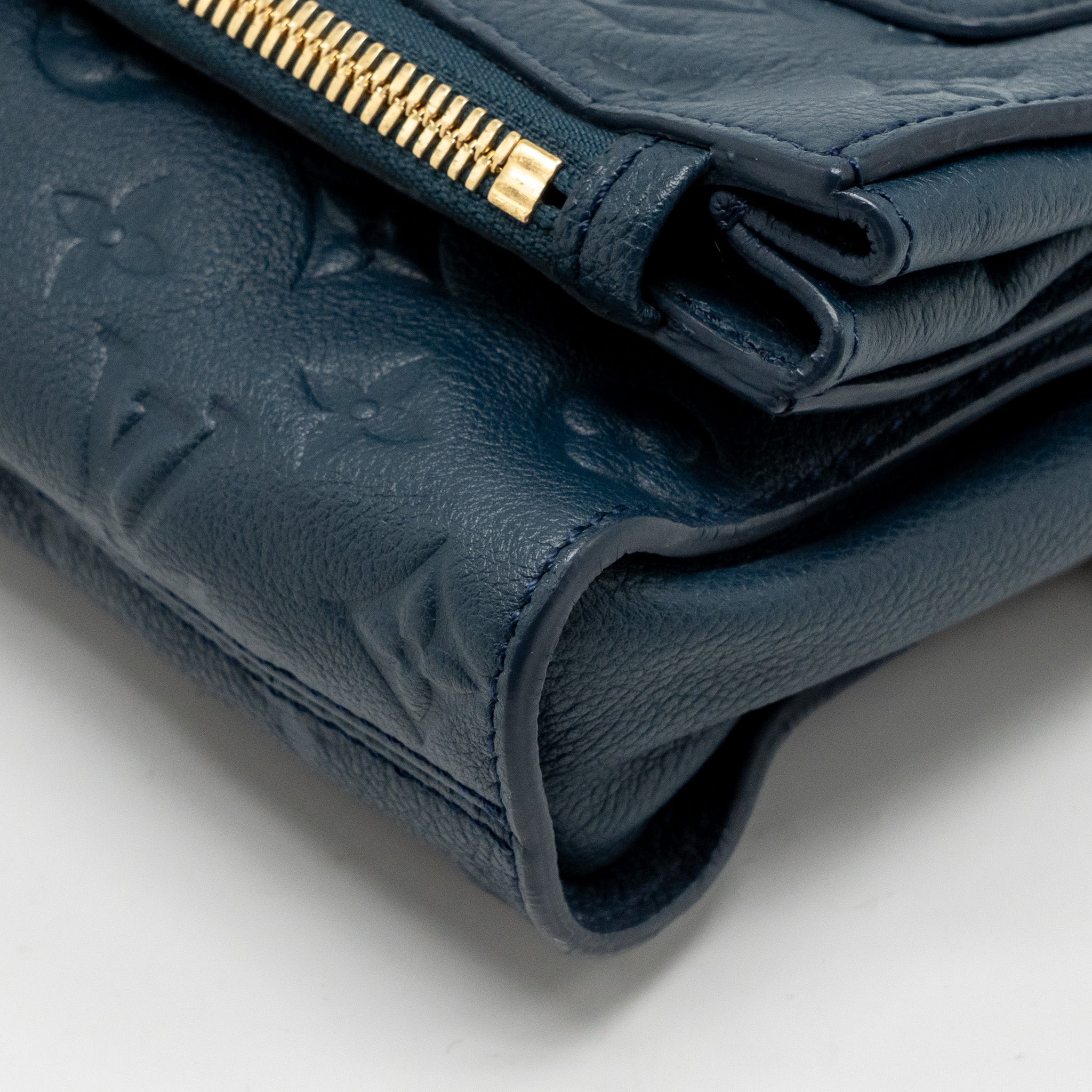 LOUIS VUITTON PETILLANTE CLUTCH MONOGRAM EMPREINTE LEATHER DARK BLUE GHW