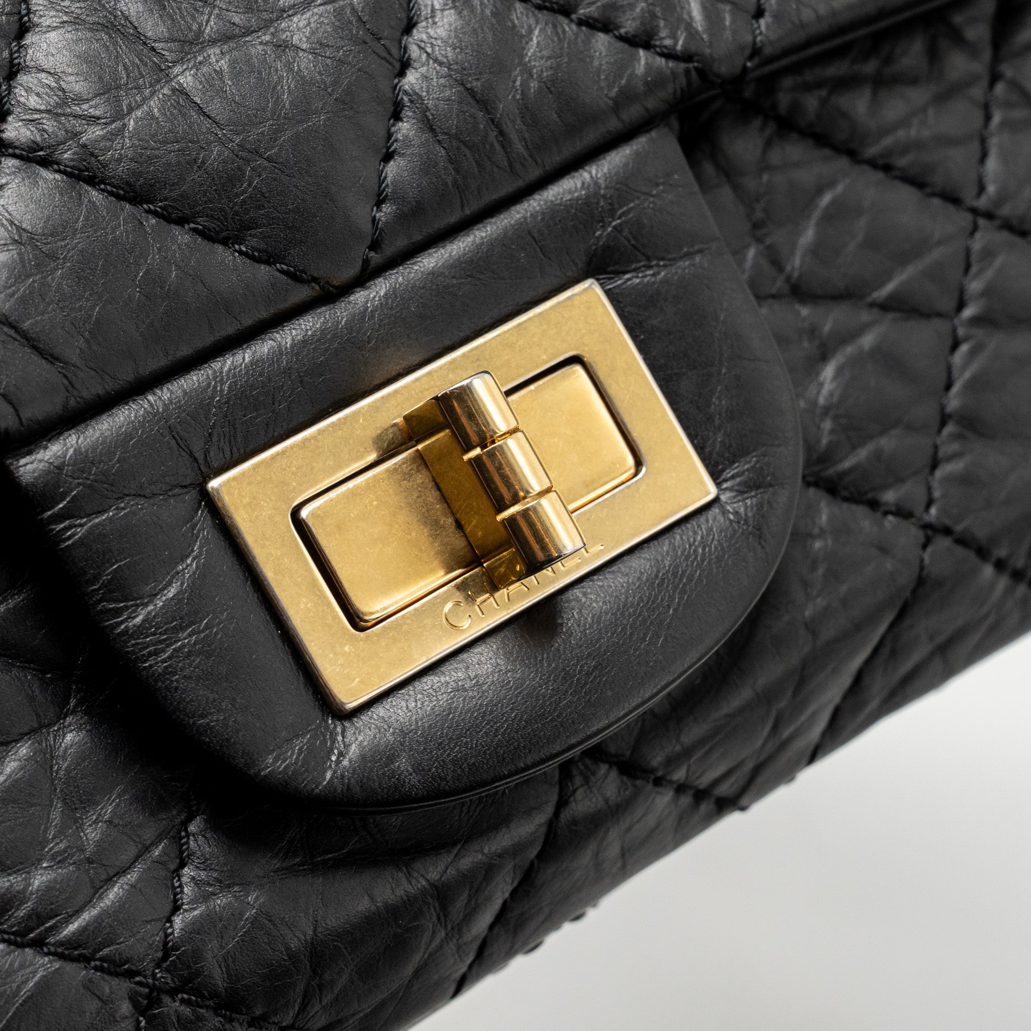 CHANEL MAXI 2.55 REISSUE DOUBLE FLAP BAG AGED CALFSKIN BLACK GHW
