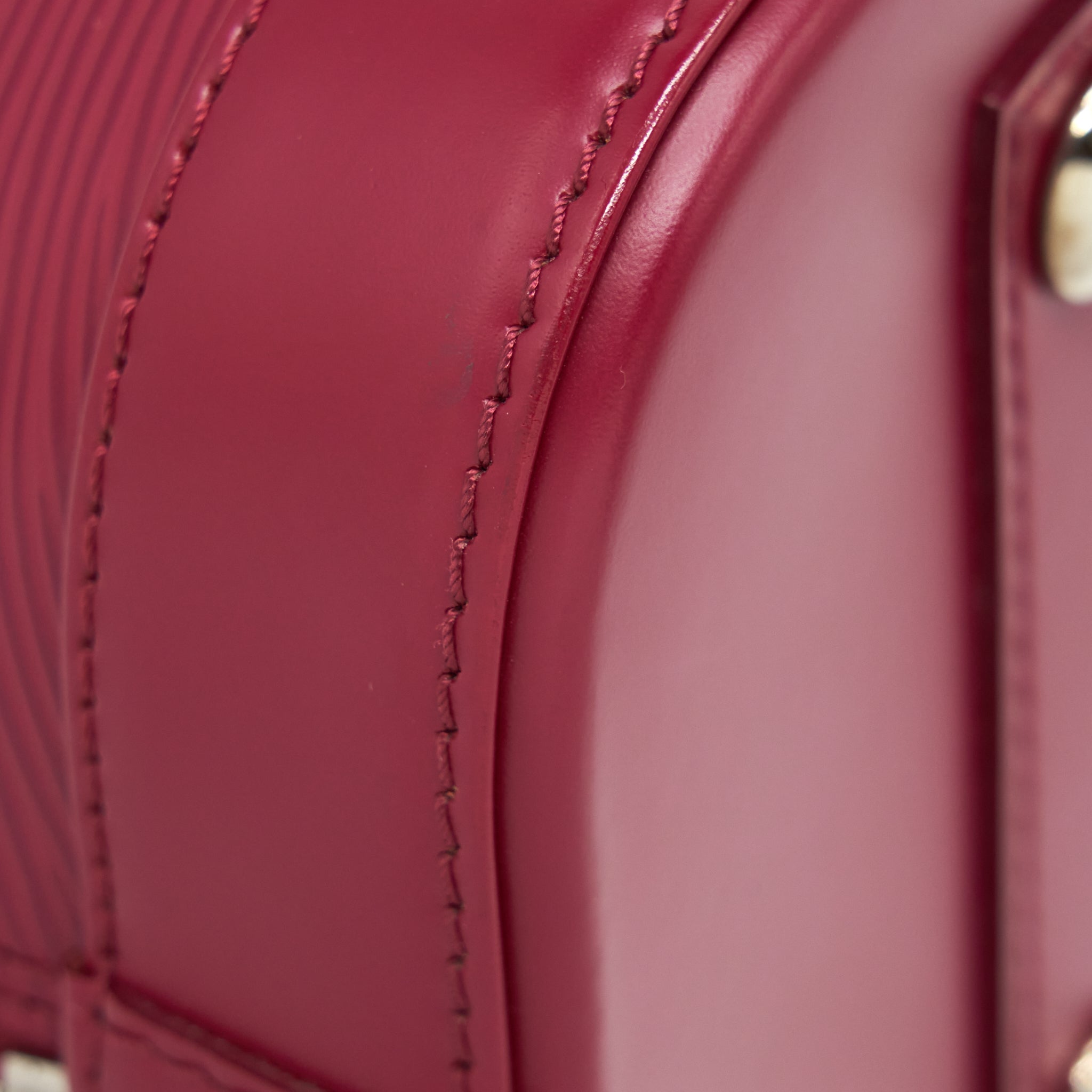 LOUIS VUITTON ALMA PM EPI DARK RED SHW WITH INITIAL J.Y ON KEY TAG
