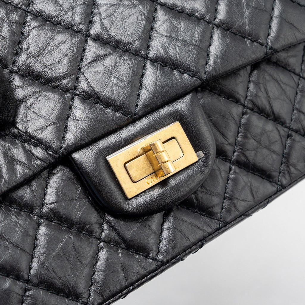 CHANEL MINI 2.55 REISSUE FLAP BAG AGED CALFSKIN BLACK GHW