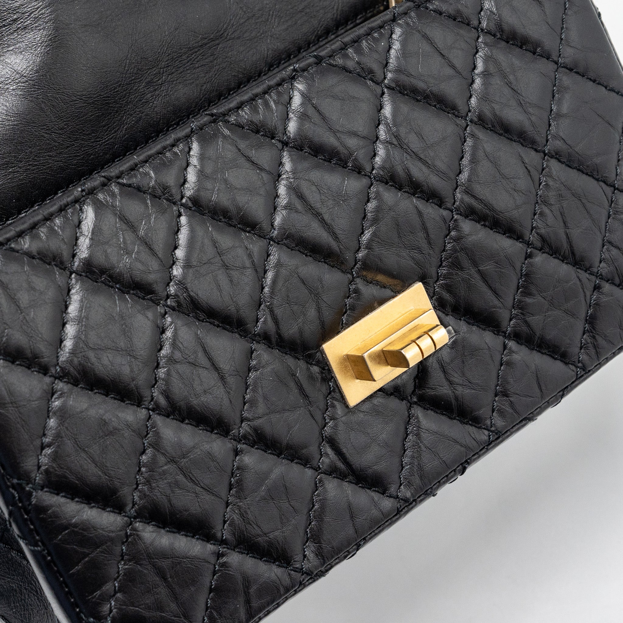 CHANEL MINI 2.55 REISSUE FLAP BAG AGED CALFSKIN BLACK GHW