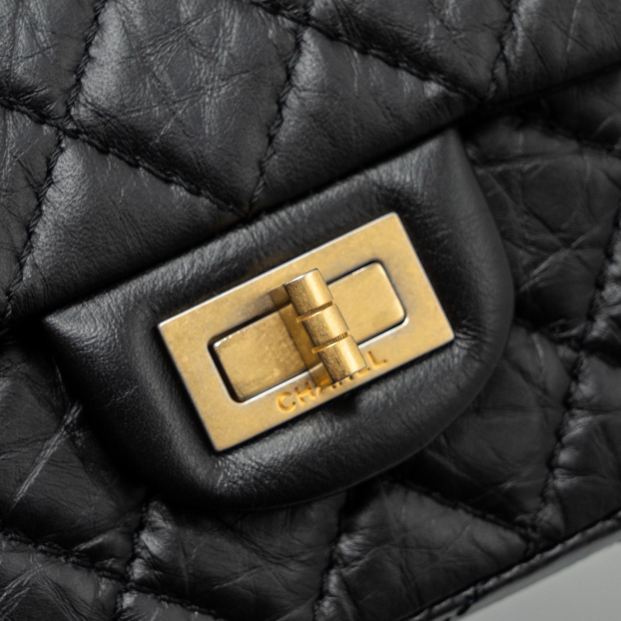 CHANEL MINI 2.55 REISSUE FLAP BAG AGED CALFSKIN BLACK GHW
