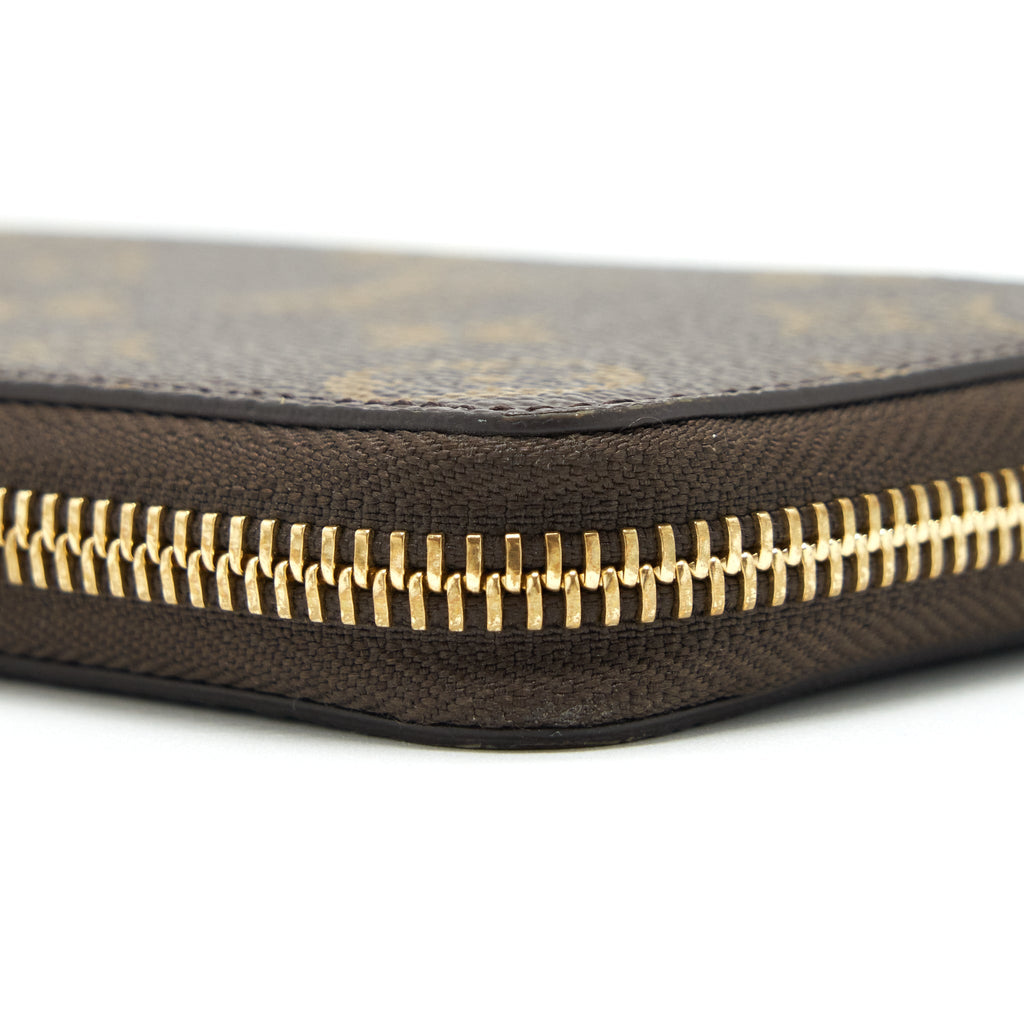 LOUIS VUITTON CLEMENCE LONG WALLET MONOGRAM CANVAS FUCHSIA