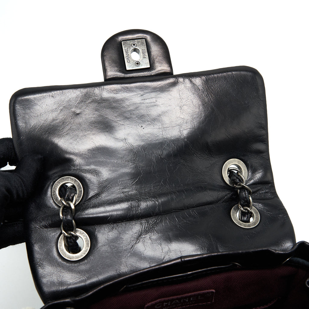 CHANEL MOUNTAIN SMALL BACKPACK SHEARLING WITH QUILTED CALFSKIN RUTHENIUM HARDWARE