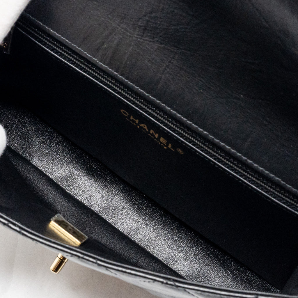 CHANEL 23A CLASSIC FLAP CLUTCH SHINY CALFSKIN BLACK LGHW (MICROCHIP)