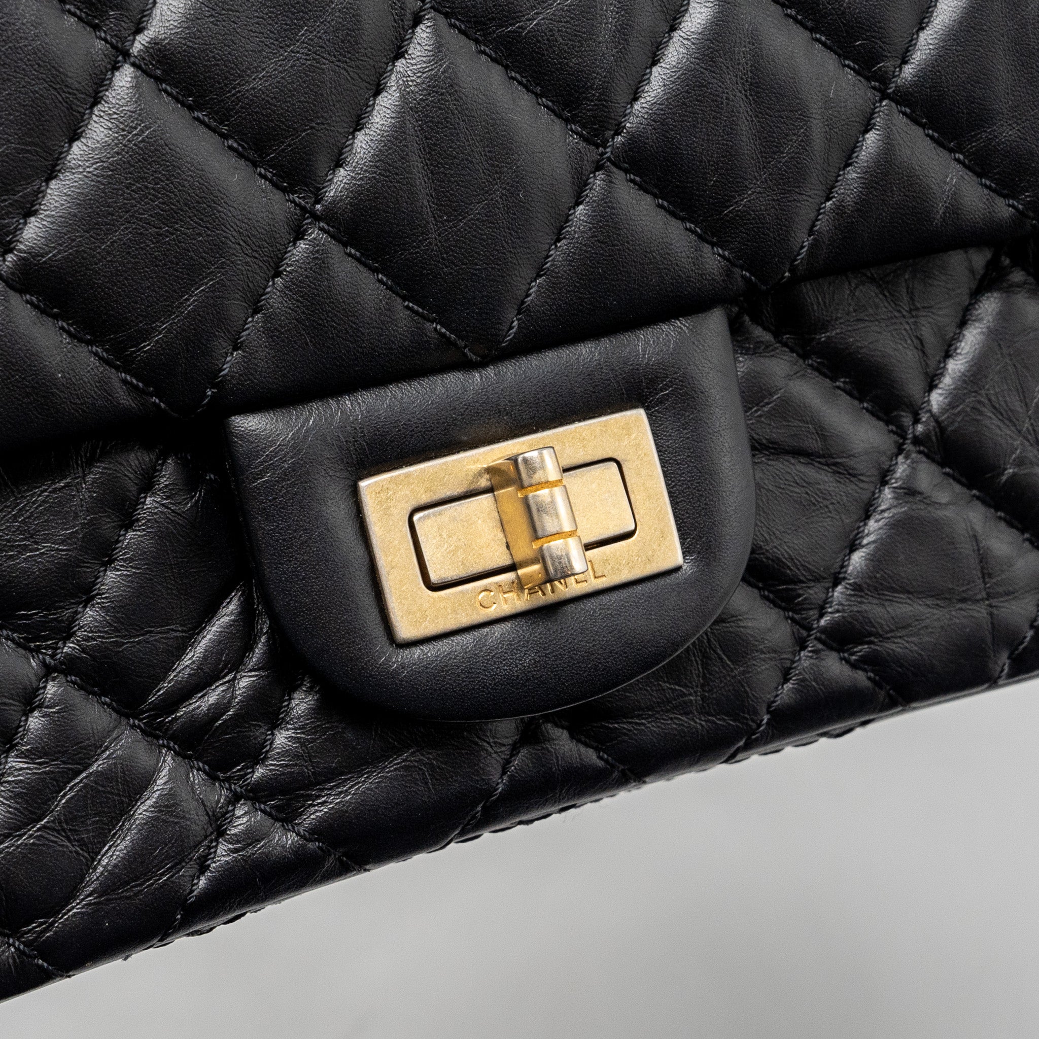 CHANEL SMALL 2.55 REISSUE DOUBLE FLAP BAG AGED CALFSKIN BLACK GHW
