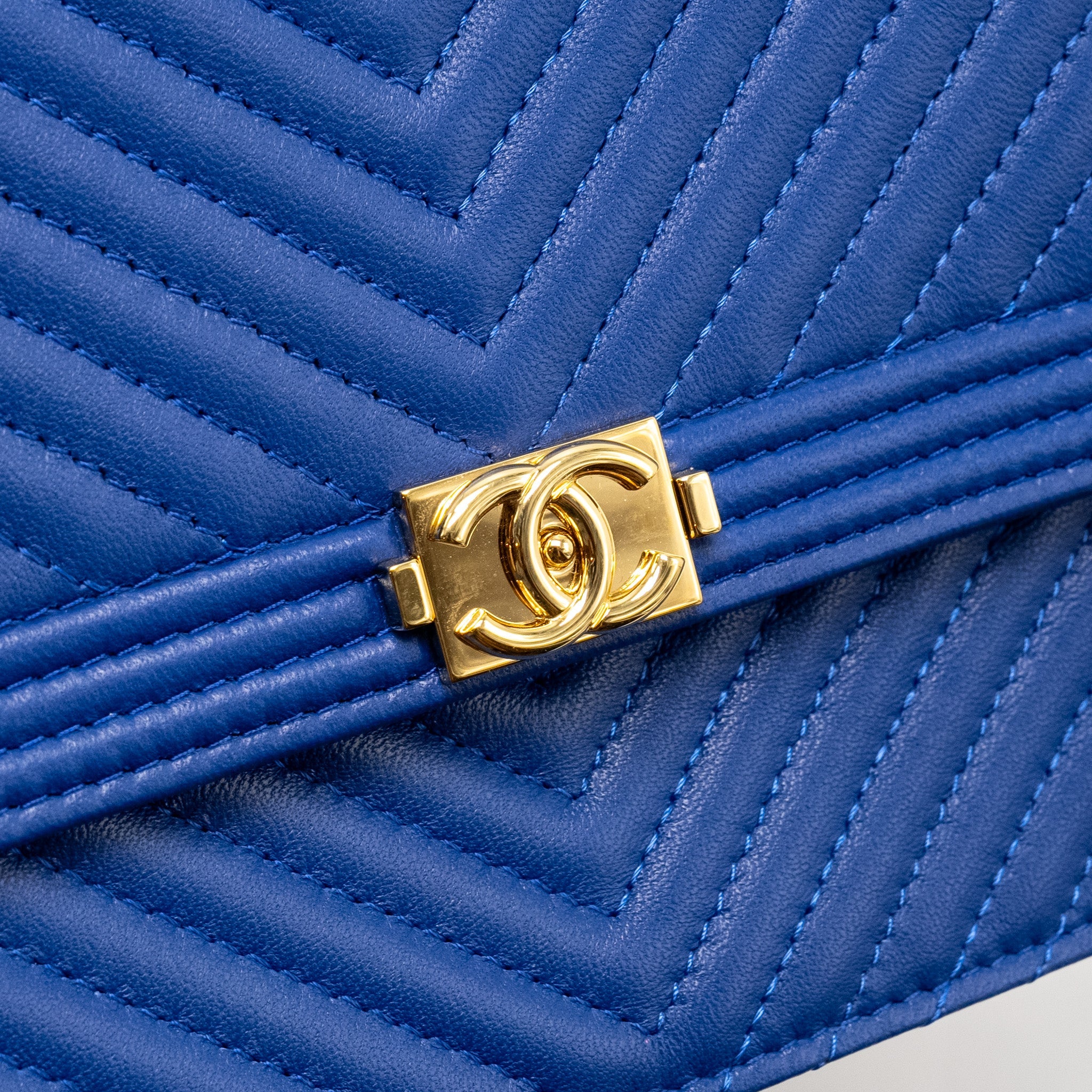 CHANEL BOY CLUTCH WITH CHAIN  CHERVON LAMBSKIN BLUE GHW