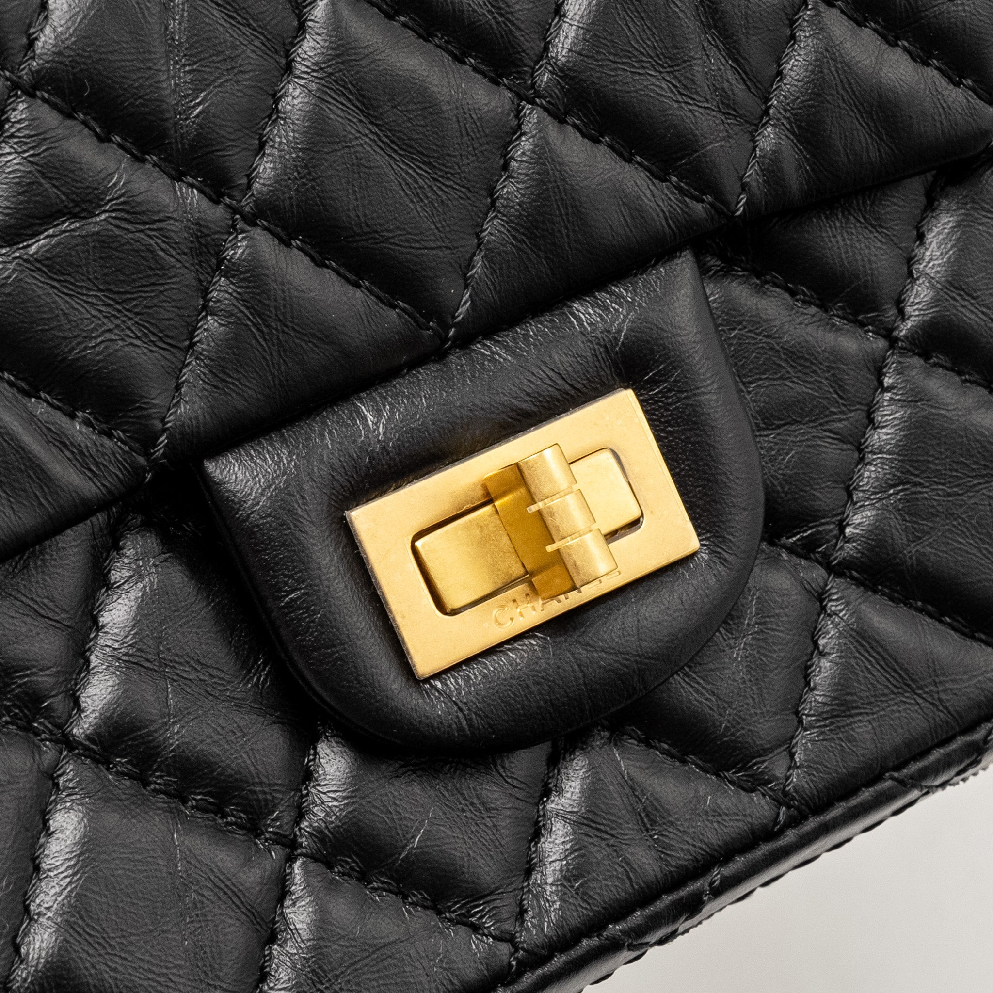 CHANEL MINI 2.55 REISSUE FLAP BAG AGED CALFSKIN BLACK BRUSHED GHW (MICROCHIP)